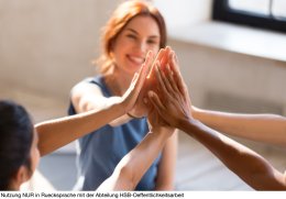 Girls giving high five, close up focus on hands