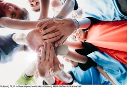 Low angle view of kids Football School Team huddling together