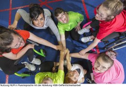 Group of special needs girls showing team spirit