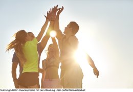 Athletes high fiving after successful workout