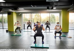 Group Of People Exercising With Male Trainer In The Gym - Reopening Business