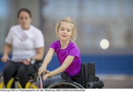 Girl in a Wheelchair Playing Sports