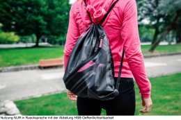 Unrecognizable sportswoman with backpack going to the gym