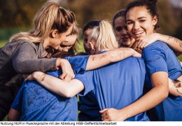 Female Rugby Players Together in a Huddle