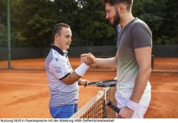 Young man with Down syndrome on tennis court