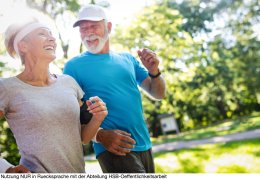 Beautiful mature couple jogging in nature living healthy